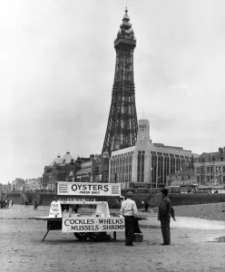An Oyster stall selling shell fish on the beach in front of the iconic Blackpool Tower An Oyster stall selling shell fish on the beach in front of the iconic Blackpool Tower