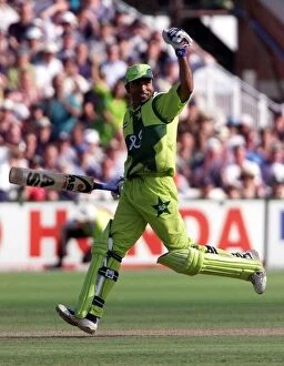 Images Dated 16th June 1999: Pakistans Saeed Amwar celebrates his 100 during the Cricket World Cup match
