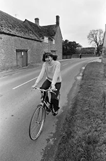 Pam Ayres riding her bicycle near her home in a village in Oxfordshire. 12th May 1977 Pam Ayres riding her bicycle near her home in a village in Oxfordshire. 12th May 1977