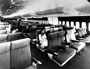 Passengers sit inside the massive interior of the Boeing 747. 12 / 01 / 1970