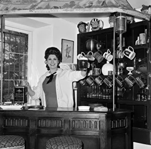 Pat Phoenix at home in her bar. 16th April 1968 Pat Phoenix at home in her bar. 16th April 1968