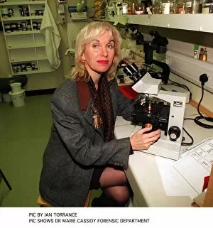 Images Dated 1st February 1996: Pathologist doctor Marie Cassidy sitting at microscope in laboratory In charge as