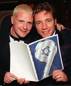 Paul Gascoigne and ally McCoist check out the nine in a row book Paul Gascoigne and ally McCoist check out the nine in a row book