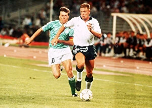Paul Gascoigne battles with Lothar Matthaus in the game between England and Germany