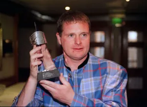 Paul Gascoigne Rangers football player with award trophy Paul Gascoigne Rangers football player with award trophy