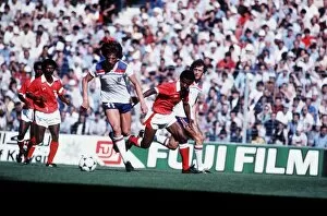 Images Dated 25th June 1982: Paul Mariner of England during football World Cup 1982 running with ball England 1