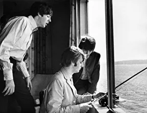 Paul McCartney, George Harrison and Ringo Starr fishing in Puget Sound from their hotel Paul McCartney, George Harrison and Ringo Starr fishing in Puget Sound from their hotel