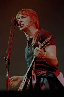 Images Dated 13th July 1997: Paul Weller playing guitar and singing at T in the Park at Balado Airfield near Kinross