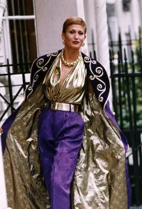 Paula Hamilton model modelling a purple and gold brocate evening coat DBase Paula Hamilton model modelling a purple and gold brocate evening coat DBase