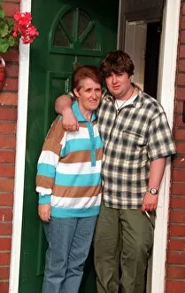 Images Dated 12th September 1996: Peggy Gallagher Oasis mum is hugged by son Paul as they look sad after the reported break