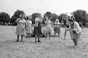 Images Dated 8th August 1976: Pensioners playing with Hula Hoops in a Twickenham park