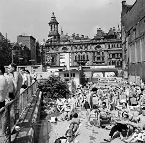 People enjoying the warm weather at Endell Street open air baths, London. 5th August 1954 People enjoying the warm weather at Endell Street open air baths, London. 5th August 1954