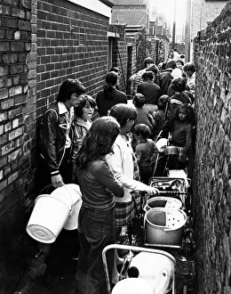 People queue in a back alley off David Street the Holy Land, in Dingle People queue in a back alley off David Street the Holy Land, in Dingle