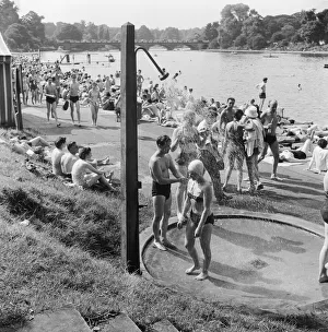 People sunbathing in a heatwave at the Serpentine Lido, Hyde Park, London People sunbathing in a heatwave at the Serpentine Lido, Hyde Park, London