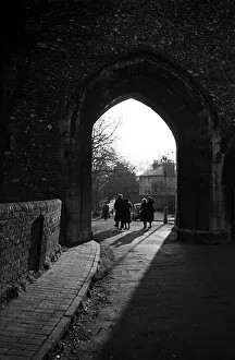 00511 Gallery: People walk through an arch near St Albans Cathedral, Hertfordshire. Circa 1946