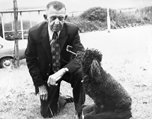 Pepe the poodle enjoys an occasional puff of his masters pipe Pepe the poodle enjoys an occasional puff of his masters pipe