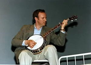 Images Dated 11th May 1993: Peter Davison Actor - playing a banjo