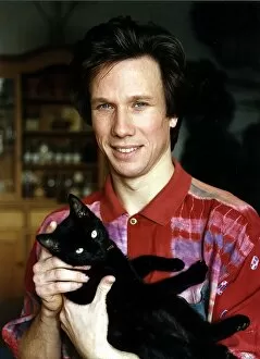 Images Dated 30th September 1993: Peter Duncan TV Presenter holding cat