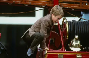Peter Phillips January 1988 son of Princess Anne scrambles over top of old fire Peter Phillips January 1988 son of Princess Anne scrambles over top of old fire