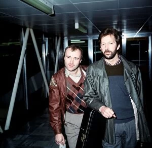 Images Dated 6th March 1984: Phil Collins Singer Songwriter Actor with Eric Clapton leaving London Airport for