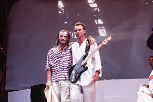 Phil Collins and Sting stand on the stage at Live Aid Charity concert at Wembley Stadium Phil Collins and Sting stand on the stage at Live Aid Charity concert at Wembley Stadium