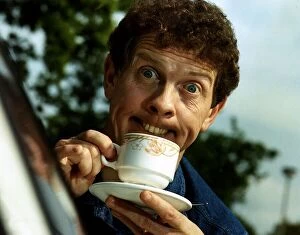 Images Dated 7th May 1992: Phil Cool Comic pulling funny face holding cup and saucer Dbase