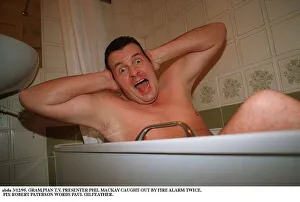 Phil MacKay Grampian TV Presenter in the bath hands on ears Fire Alarm story Phil MacKay Grampian TV Presenter in the bath hands on ears Fire Alarm story