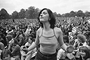 Picture shows a fan dancing amongst the huge audience at London Hyde Park for a concert Picture shows a fan dancing amongst the huge audience at London Hyde Park for a concert