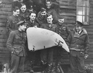 Pilots from 501 squadron show off the tailplane rudder of a Messerschmitt 109 at RAF Pilots from 501 squadron show off the tailplane rudder of a Messerschmitt 109 at RAF