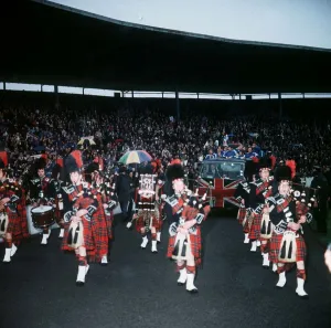 A Pipe band leads Rangers players in a parade around Ibrox Park on lorry with A Pipe band leads Rangers players in a parade around Ibrox Park on lorry with