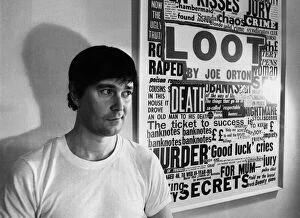 Facial Expressions Gallery: Playwright Joe Orton next to a promotional poster of his new play Loot