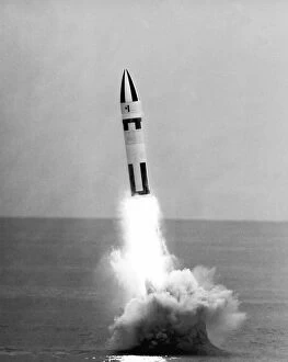 00489 Gallery: A Polaris A-3 missile ignites its main rocket motor after being launched from the USS