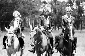 00864 Gallery: The Police, pop / rock group, pictured on horses. Left is guitarist Andy