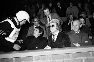 Images Dated 25th October 1977: A policeman talking to Graham Taylor and Elton John, who are watching the football match