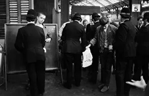 Images Dated 31st August 1981: Policemen searching Skinheads at Brighton station 1981