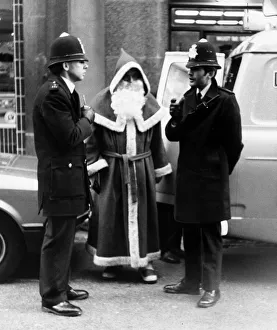 Policemen speak to Santa Claus outside Harrods Store in London after being nicked for Policemen speak to Santa Claus outside Harrods Store in London after being nicked for