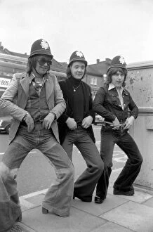 Pop Group 'Mud' dressed in police helmets May 1975