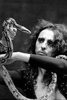 Pop singer Alice Cooper aged 23 flew into Heathrow Airport today with his pet boa
