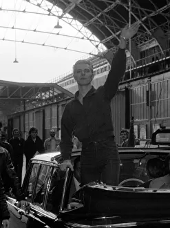 Pop singer David Bowie waves to fans as he arrives at Victoria Station May 1976 Pop singer David Bowie waves to fans as he arrives at Victoria Station May 1976
