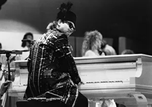Pop star Elton John at the piano as he performs at the Live Aid concert held at Wembley Pop star Elton John at the piano as he performs at the Live Aid concert held at Wembley