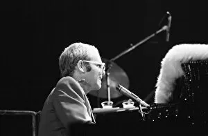 Images Dated 11th May 1976: Pop star Elton John on stage at Earls Court, London. This is his first London concert