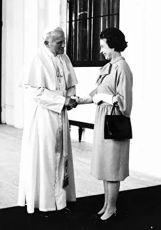 Pope John Paul II holds hand of Queen Elizabeth II 1982 Pope John Paul II holds hand of Queen Elizabeth II 1982