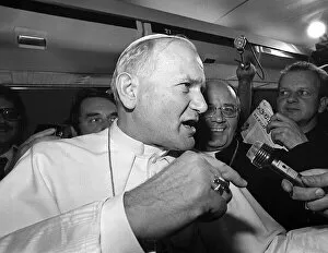 Pope John Paul II is interviewed during a flight on his visit to Ireland
