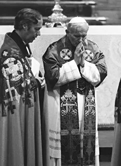 Pope John Paul II during his visit to Britain in 1982 in pray at the altar during a