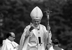 Pope John Paul II waves to the welcoming crowd at Cardiff airport LFEY003
