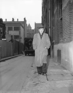 00511 Gallery: Portrait of boxer, Teddy Baldock, waking down a street. August 1956