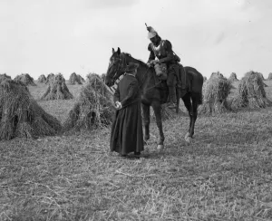 A priest talks to a French Cuirassiers in a corn field on the Belgium - France border A priest talks to a French Cuirassiers in a corn field on the Belgium - France border