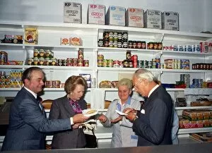 Prime Minister Margaret Thatcher, accompanied by her husband Dennis