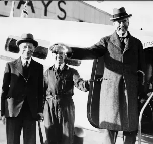 Prime Minister Neville Chamberlain steps off a plane wearing an overcoat and a hat Prime Minister Neville Chamberlain steps off a plane wearing an overcoat and a hat