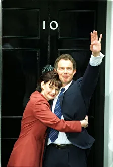 Prime Minister Tony Blair And Cherie Blair, waving to the crowds as they prepare to enter Prime Minister Tony Blair And Cherie Blair, waving to the crowds as they prepare to enter